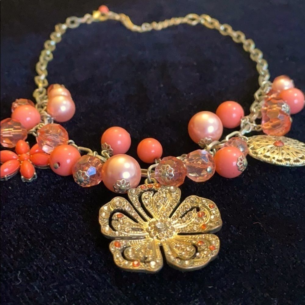 Charm necklace with pink beads